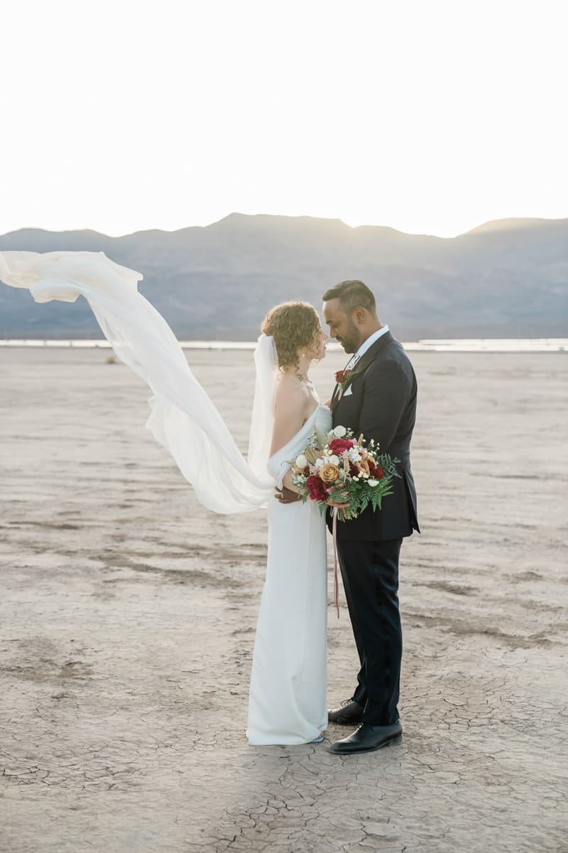 Bride and groom sharing a romantic. moment in the Dry Lake Bed in Boulder City, NV.