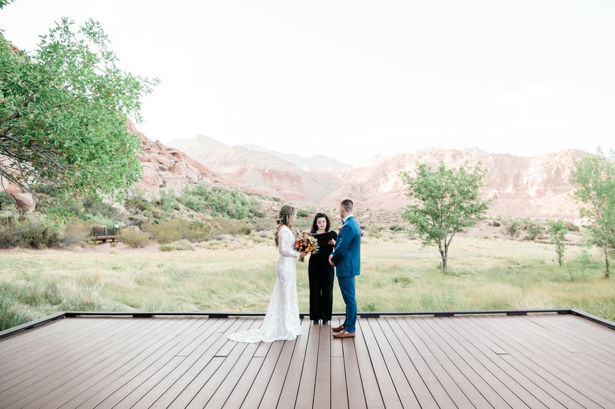 Bride and groom getting married outdoors at a Las Vegas destination wedding.